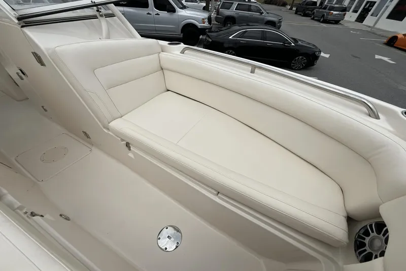 Slide: The Image of 2023 Grady-White Freedom 275 boat interior with white cushioned seating. - 15