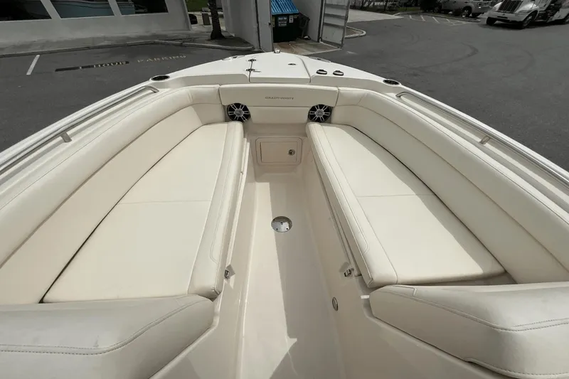 Slide: The Image of 2023 Grady-White Freedom 275 boat interior with white cushioned seating. - 16