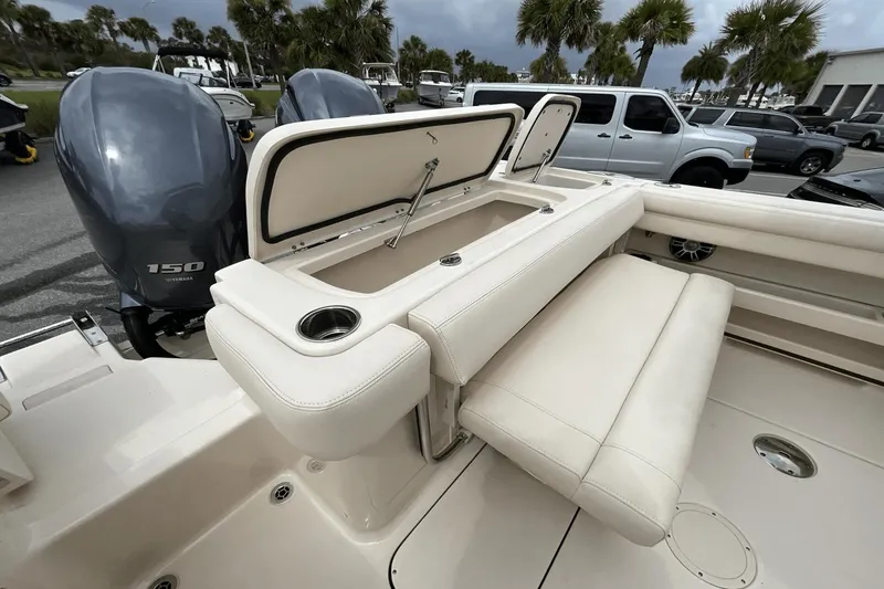 Slide: The Image of 2023 Grady-White Freedom 275 boat interior with seating and storage. - 21