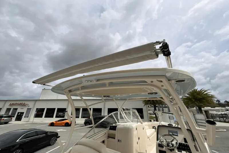 Slide: The Image of 2023 Grady-White Freedom 275 boat with canopy, parked at MarineMax dealership. - 24
