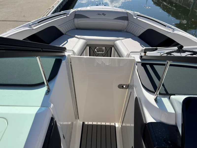 Slide: The Image of 2023 Sea Ray SLX 260 Outboard boat interior with sleek seating and open deck. - 17