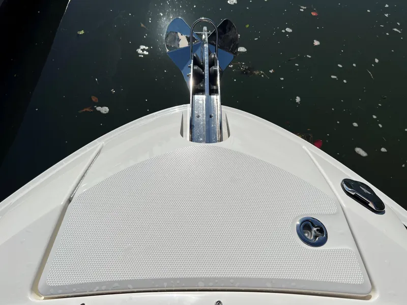 Slide: The Image of Bow of 2023 Sea Ray SLX 260 Outboard, featuring anchor and textured deck. - 18