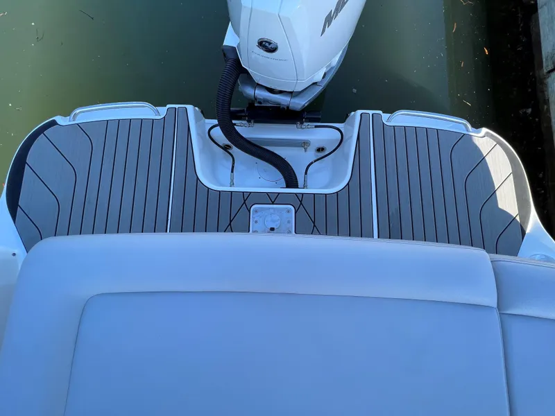 Slide: The Image of 2023 Sea Ray SLX 260 Outboard boat deck with modern design and outboard motor. - 2