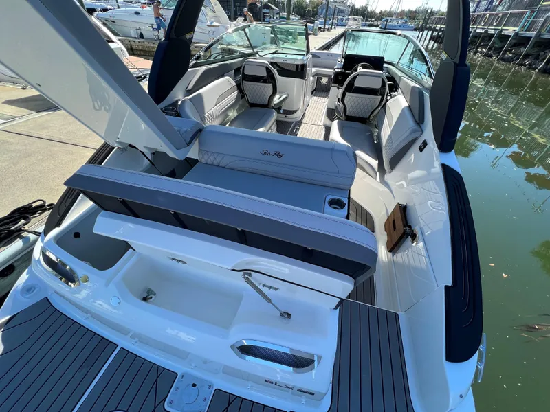 Slide: The Image of 2023 Sea Ray SLX 260 Outboard boat interior with luxurious seating and modern design. - 3