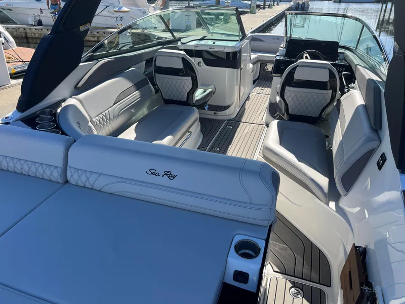 Slide: The Image of 2023 Sea Ray SLX 260 Outboard boat interior with luxurious seating and modern design. - 4