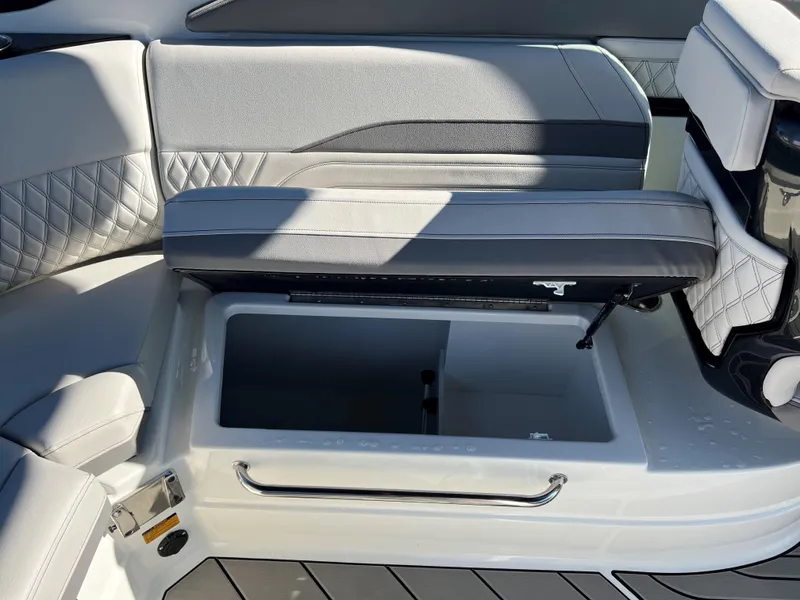 Slide: The Image of 2023 Sea Ray SLX 260 Outboard boat seat with storage compartment open. - 5