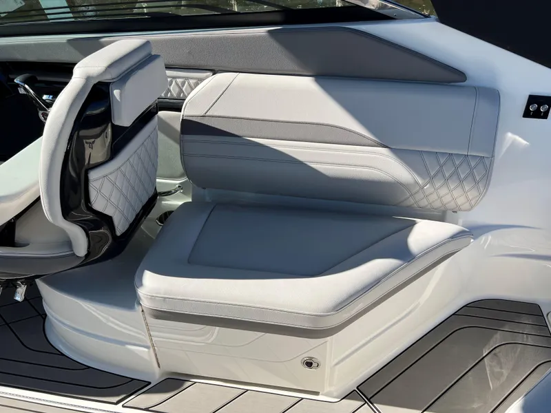 Slide: The Image of 2023 Sea Ray SLX 260 Outboard interior seating with elegant gray upholstery. - 7