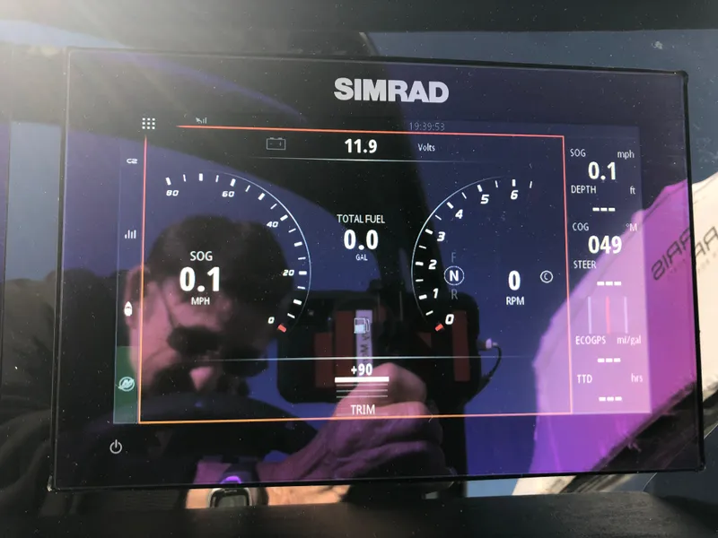 Slide: The Image of Simrad display on 2023 Harris Solstice 250 showing speed, fuel, and navigation data. - 14