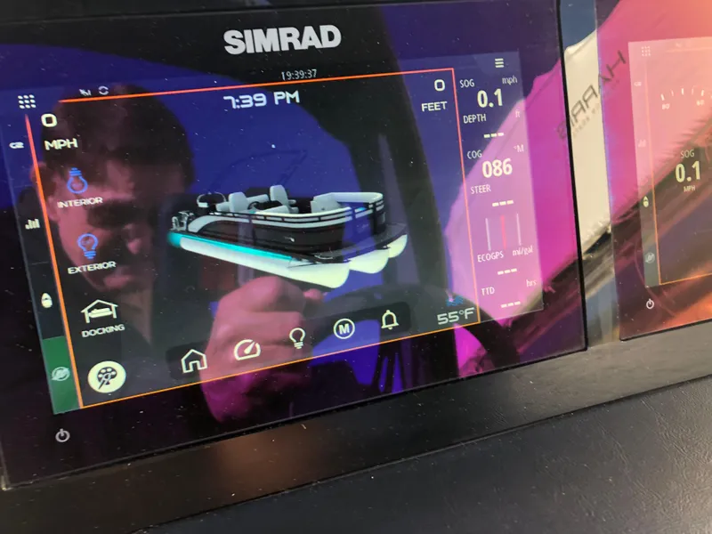Slide: The Image of Simrad display on 2023 Harris Solstice 250 boat dashboard showing navigation and control settings. - 17