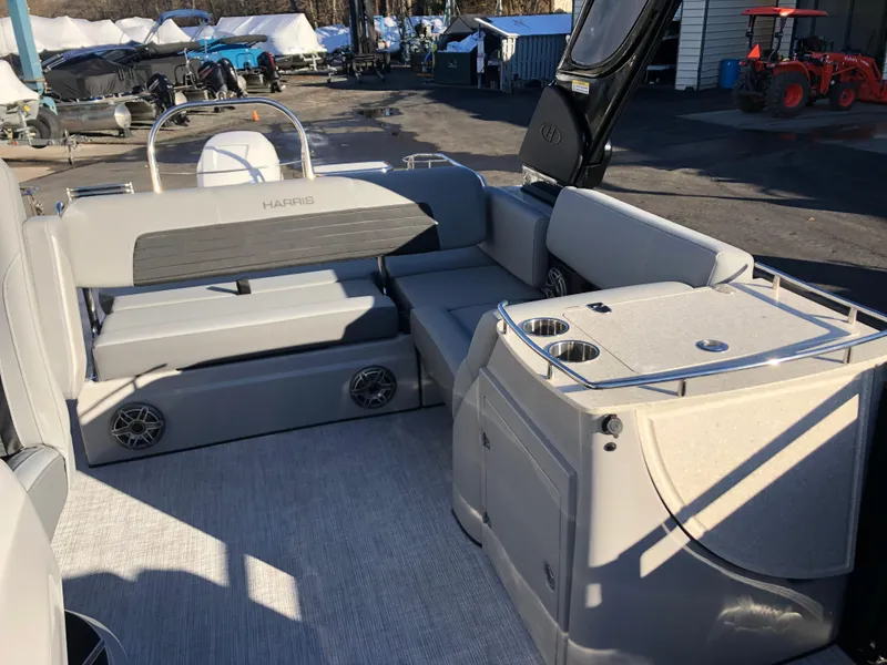 Slide: The Image of 2023 Harris Solstice 250 boat interior with seating and storage compartments. - 22