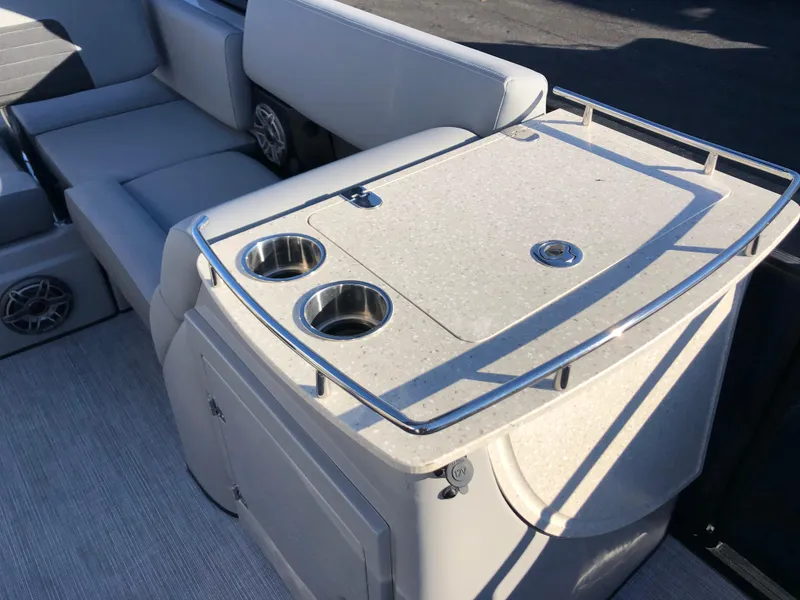 Slide: The Image of 2023 Harris Solstice 250 boat interior with seating and cup holders. - 23