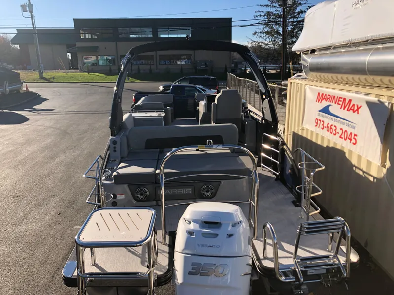 Slide: The Image of 2023 Harris Solstice 250 pontoon boat at MarineMax dealership. - 4