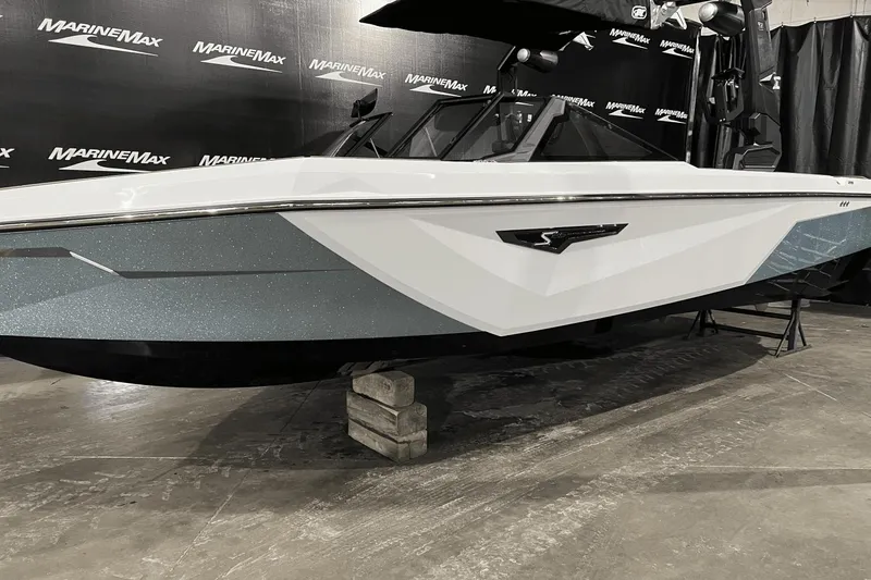 Slide: The Image of 2023 Nautique Super Air Nautique S25 boat displayed at MarineMax showroom. - 0