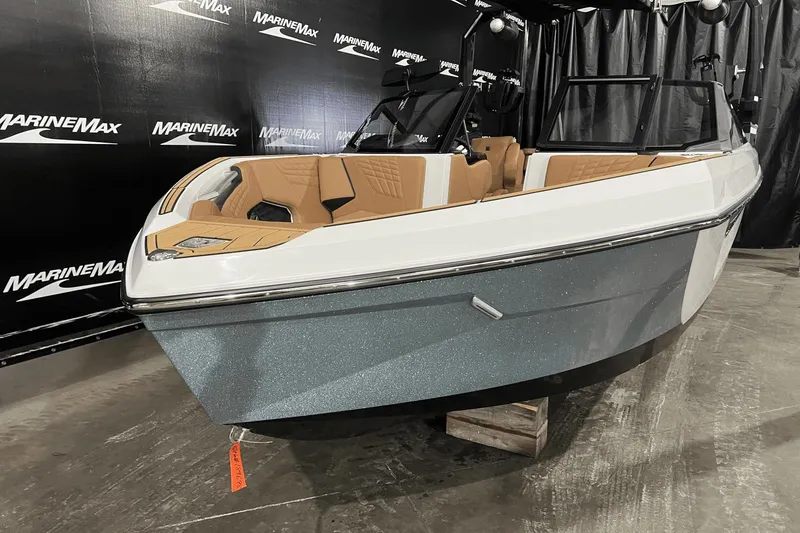 Slide: The Image of 2023 Nautique Super Air Nautique S25 boat displayed at MarineMax showroom. - 1