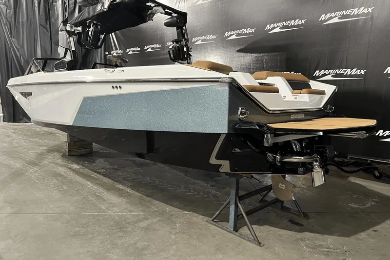 Slide: The Image of 2023 Nautique Super Air Nautique S25 boat displayed indoors at MarineMax. - 2