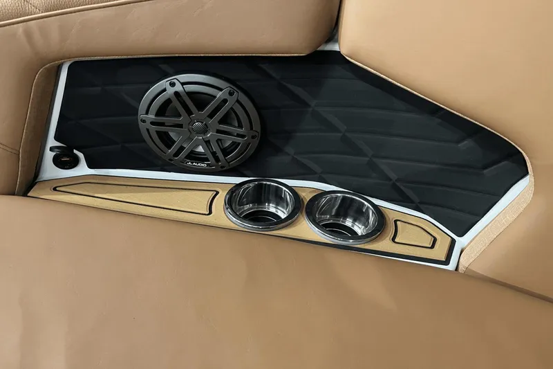 Slide: The Image of 2023 Nautique Super Air Nautique S25 interior with speaker and cup holders. - 23