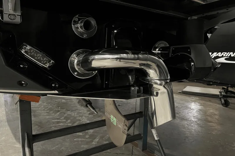 Slide: The Image of 2023 Nautique Super Air Nautique S25 boat exhaust and propeller detail. - 9