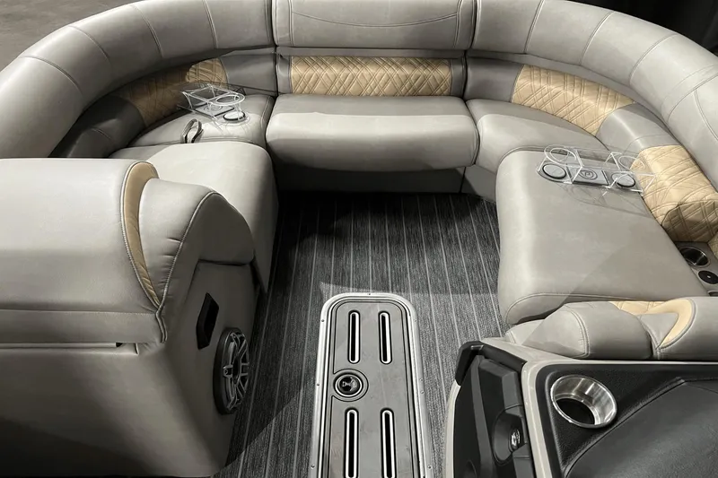 Slide: The Image of Luxurious seating area of 2024 Premier 230 Intrigue pontoon boat with cup holders and stylish upholstery. - 21