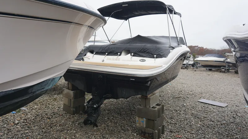 Slide: The Image of 2020 Sea Ray SPX 190 boat on blocks in a gravel lot. - 4