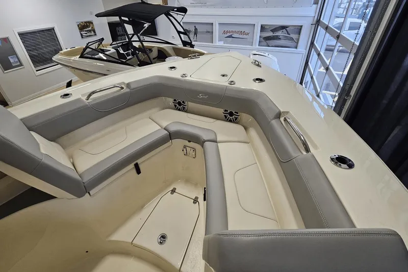 Slide: The Image of 2024 Scout 305 LXF boat interior with luxurious seating and modern design. - 36