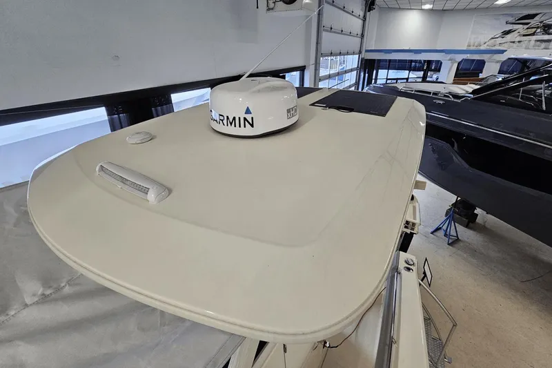 Slide: The Image of 2024 Scout 305 LXF boat with Garmin radar in showroom. - 42