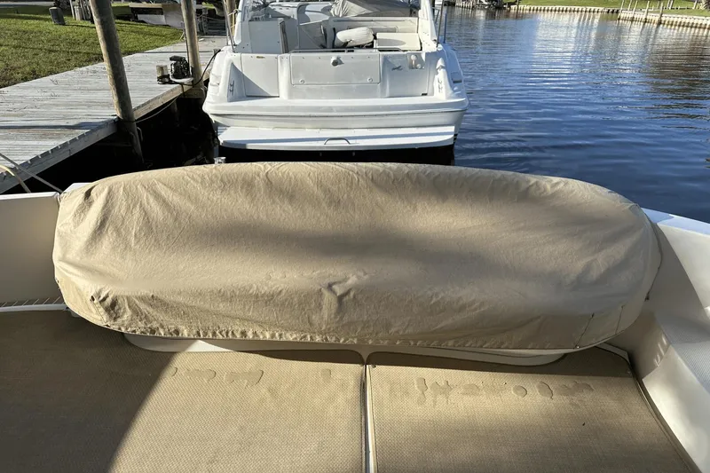 Slide: The Image of Covered seating area on a 2015 Meridian 441 Sedan yacht at a dock. - 10