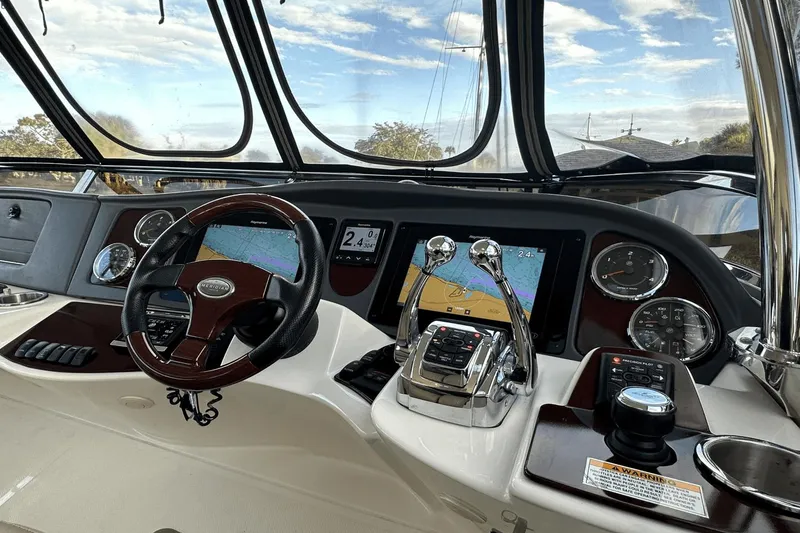 Slide: The Image of Cockpit of 2015 Meridian 441 Sedan with navigation screens and controls. - 18