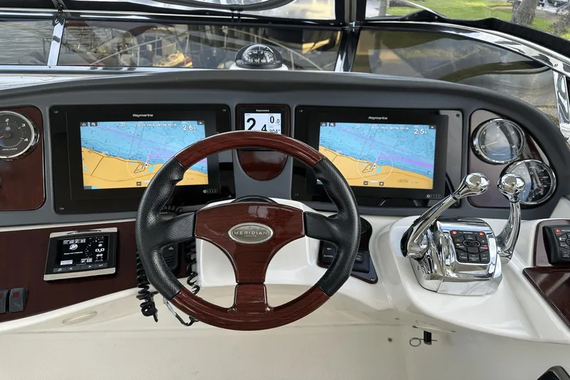 Slide: The Image of Helm of 2015 Meridian 441 Sedan with navigation screens and controls. - 22