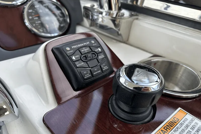 Slide: The Image of Control panel of a 2015 Meridian 441 Sedan boat with precision pilot system. - 24