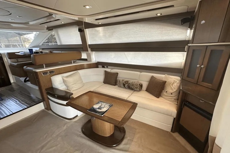 Slide: The Image of Luxurious interior of a 2015 Meridian 441 Sedan yacht with elegant seating and wooden accents. - 33