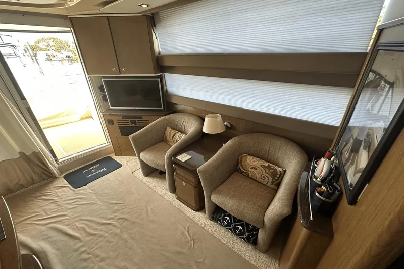 Slide: The Image of Interior of 2015 Meridian 441 Sedan yacht with cozy seating and modern decor. - 35