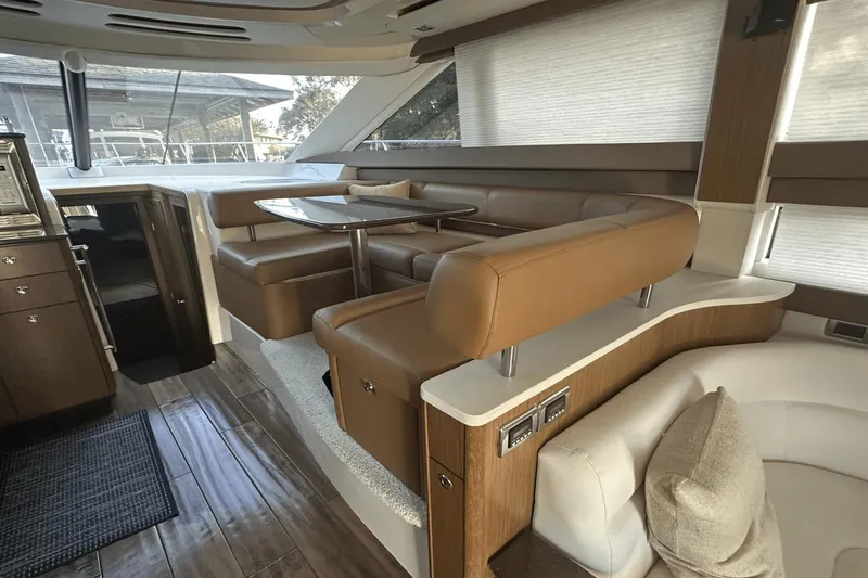 Slide: The Image of Luxurious interior of a 2015 Meridian 441 Sedan yacht with elegant seating and dining area. - 42