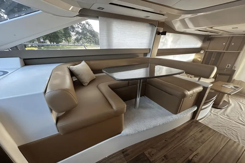 Slide: The Image of Luxurious interior of a 2015 Meridian 441 Sedan yacht with elegant seating and dining area. - 44