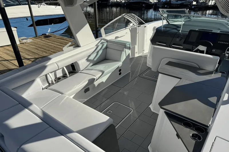 Slide: The Image of 2024 Aviara AV32 boat interior with sleek seating and modern helm design. - 7