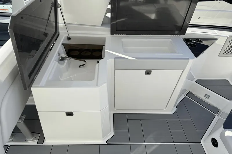 Slide: The Image of 2024 Aviara AV32 boat interior with sink and storage area. - 9