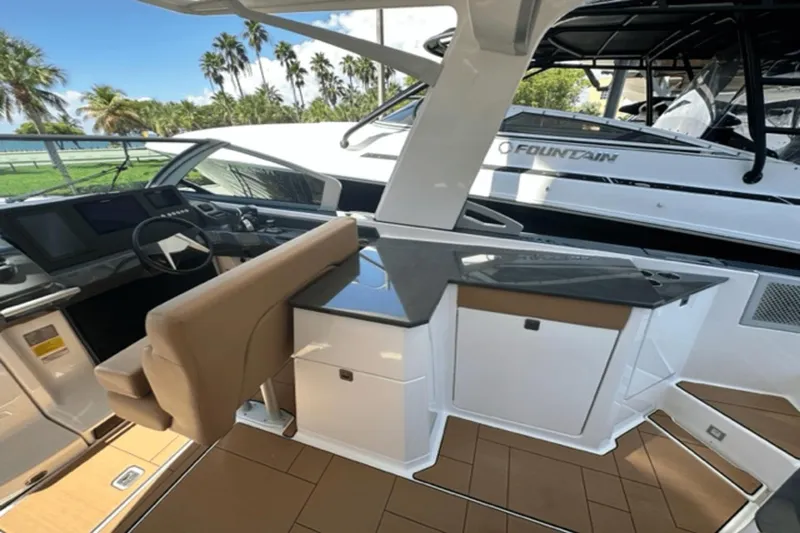 Slide: The Image of 2022 Aviara AV32 Outboard interior with helm, seating, and sleek design. - 12