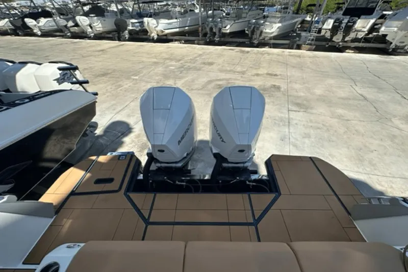 Slide: The Image of 2022 Aviara AV32 Outboard with twin Mercury engines at a marina. - 13