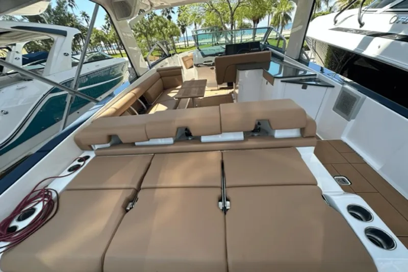 Slide: The Image of 2022 Aviara AV32 Outboard boat interior with tan seating and modern design. - 15