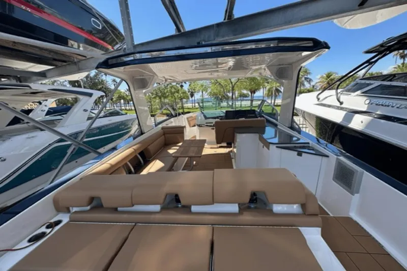 Slide: The Image of 2022 Aviara AV32 Outboard luxury boat interior with tan seating and sleek design. - 17