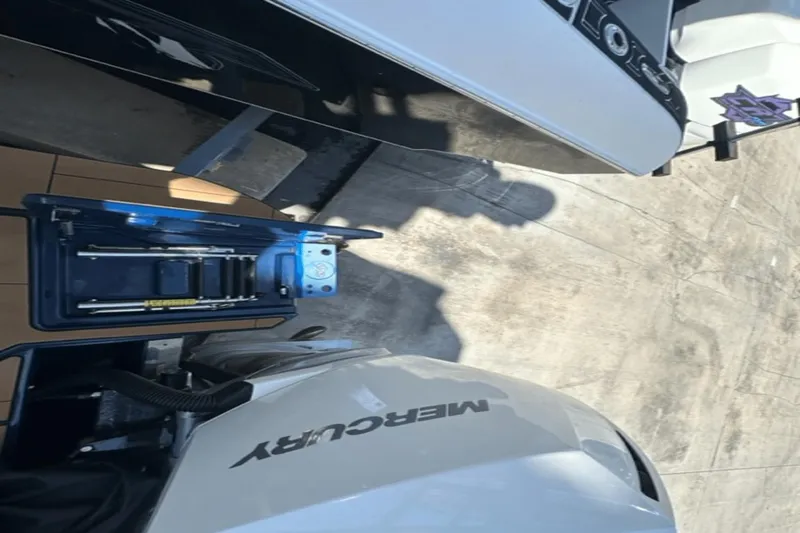 Slide: The Image of 2022 Aviara AV32 Outboard with Mercury engine, docked on concrete surface. - 21