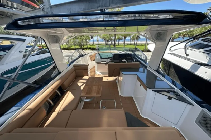 Slide: The Image of 2022 Aviara AV32 Outboard luxury boat interior with seating and table. - 22