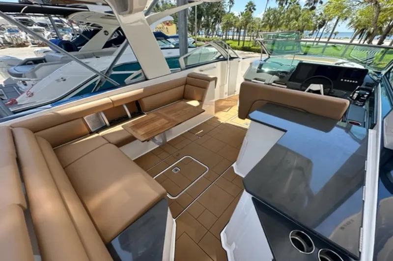Slide: The Image of Luxurious 2022 Aviara AV32 Outboard boat interior with tan seating and sleek design. - 29