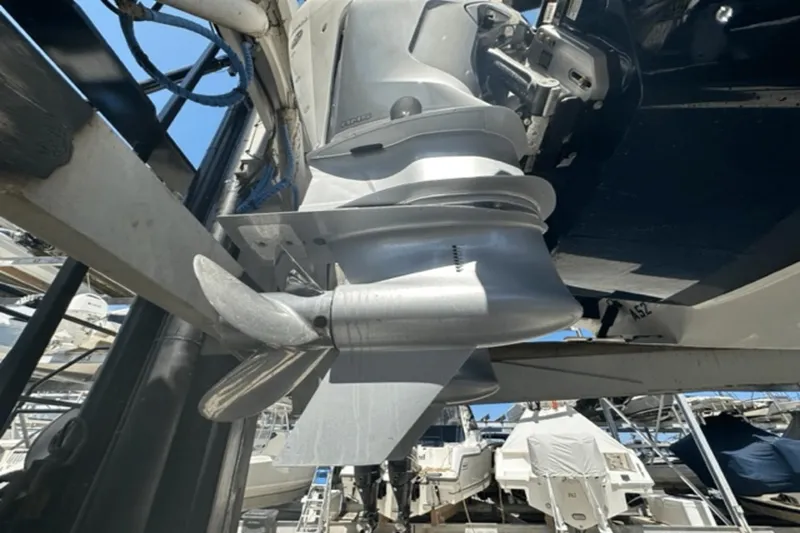 Slide: The Image of Close-up of 2022 Aviara AV32 Outboard motor and propeller in a marina. - 35