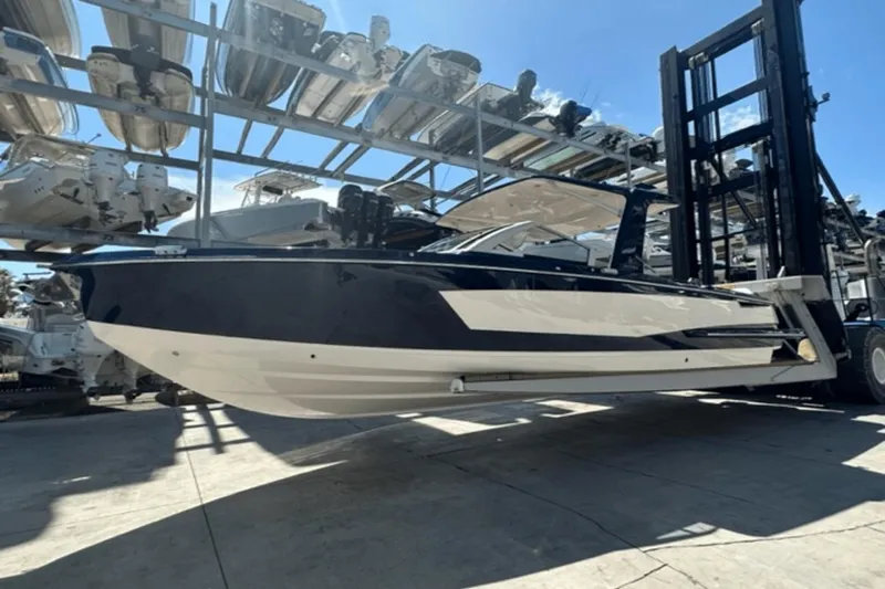 Slide: The Image of 2022 Aviara AV32 Outboard boat on a lift in a marina storage facility. - 39