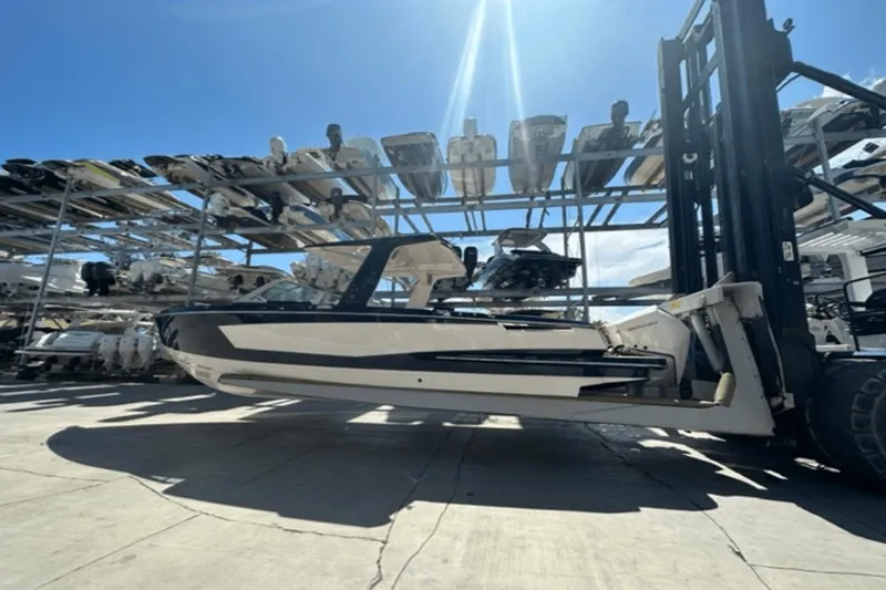 Slide: The Image of 2022 Aviara AV32 Outboard boat on forklift in storage facility. - 43