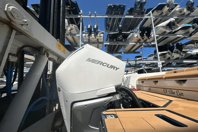 Slide: The Image of 2022 Aviara AV32 Outboard with Mercury engine in a boat storage facility. - 49