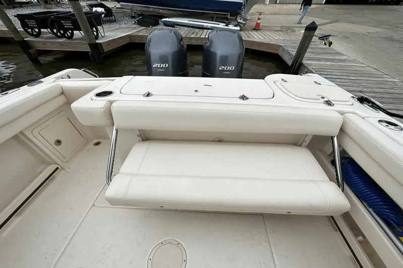 Slide: The Image of 2022 Grady-White 275 Freedom boat with dual 200 engines at dock. - 10