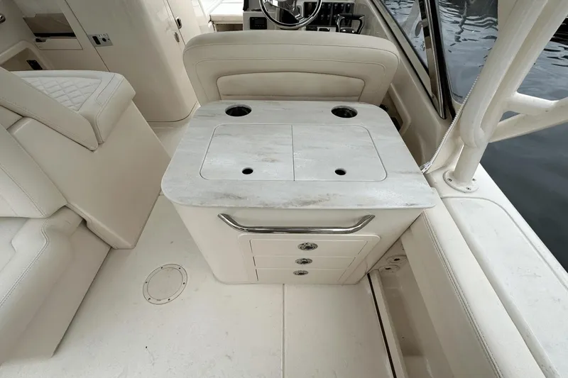 Slide: The Image of 2022 Grady-White 275 Freedom boat interior with seating and storage. - 12
