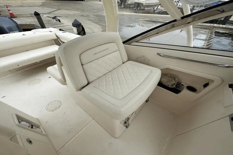 Slide: The Image of 2022 Grady-White 275 Freedom boat interior with white seating and sleek design. - 17