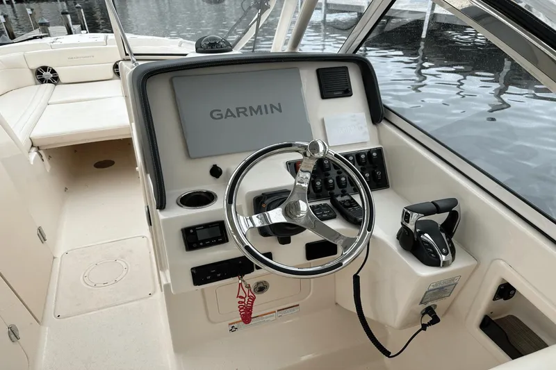 Slide: The Image of 2022 Grady-White 275 Freedom boat helm with Garmin navigation system. - 21